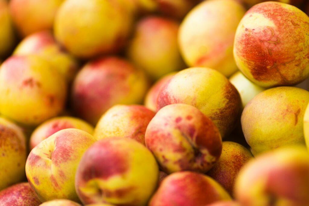 bunch of peach fruits